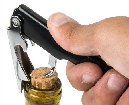 using a winged corkscrew to open a bottle of wine
