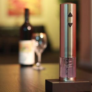 View of stylish pink Epicueanist wine opener on rechargeable stand