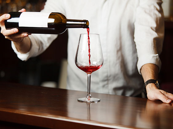 the correct way to pour red wine into a long stemmed glass