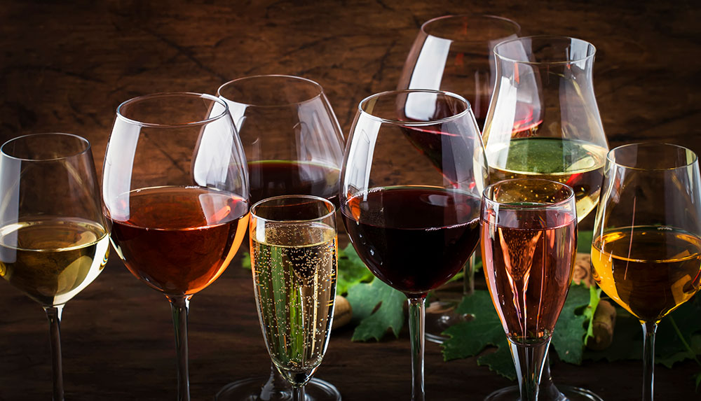 different types of glasses for champange, white wine, reds, dessert wine